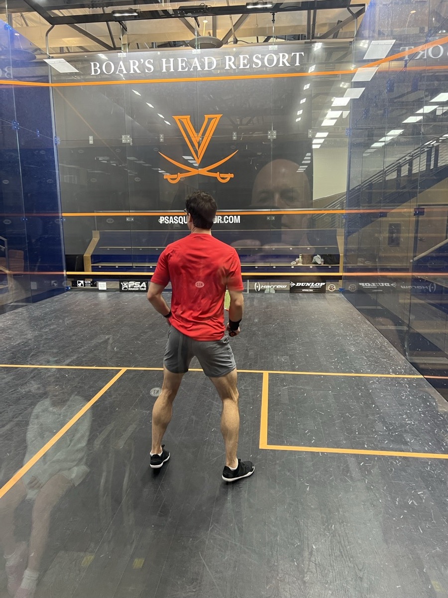 Player on court at the McArthur Squash Center, host venue for the Virginia State Open